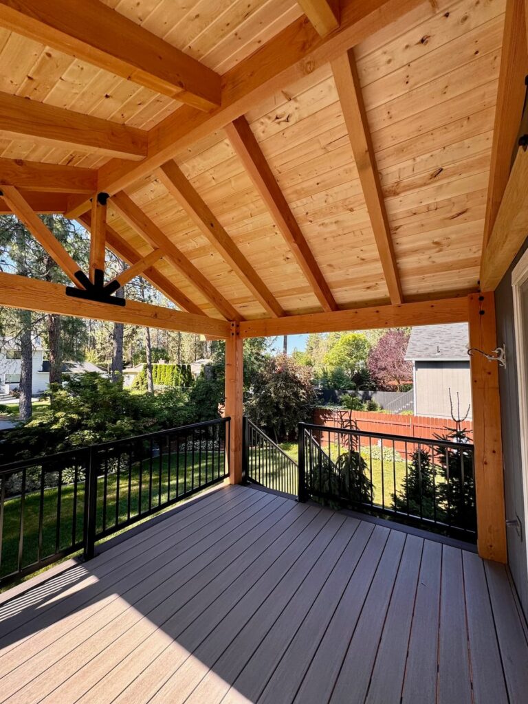 Custom-built deck with a modern pergola providing shade and style in a Spokane backyard